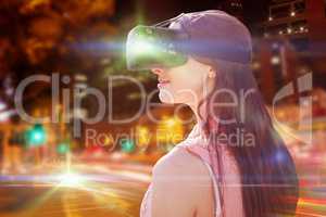Composite image of side view of young woman looking through virtual reality simulator