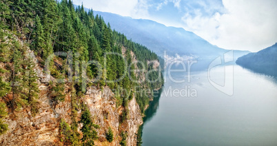 Scenic view of mountains by river