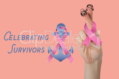 Composite image of cropped hand holding breast cancer awareness ribbon
