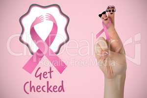 Composite image of cropped hand of woman with pnik breast cancer awareness ribbon