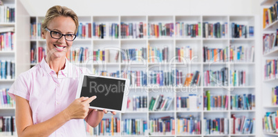 Composite image of portrait of smiling teacher holding digital tablet