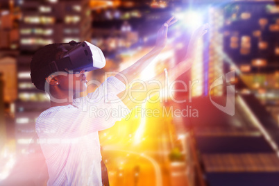 Composite image of young woman gesturing while using virtual reality simulator