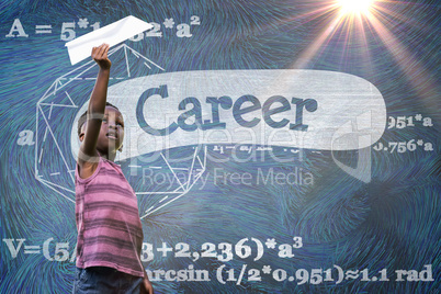 Composite image of boy holding paper airplane