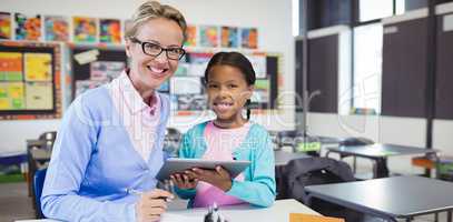 Composite image of portrait of student with teacher holding digital tablet
