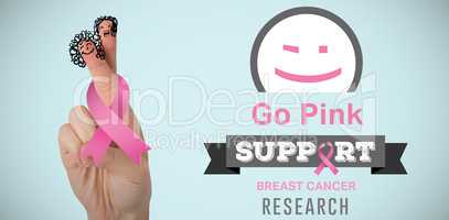 Composite image of cropped hand of woman holding pink breast cancer awareness ribbon