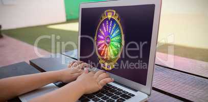 Composite image of colorful wheel of fortune on mobile screen