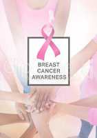 Pink Ribbon and text with breast cancer awareness women putting hands together