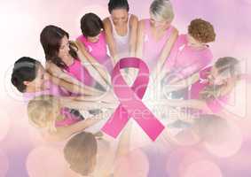 Pink Ribbon with breast cancer awareness women putting hands together