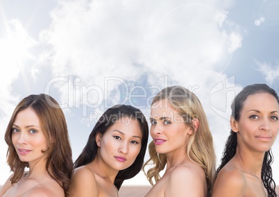 Beautiful Women's heads in sky clouds