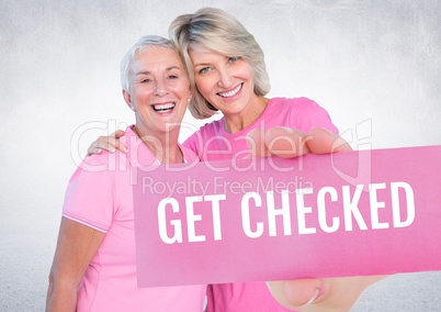 Get checked Text and Hand holding card with pink breast cancer awareness women