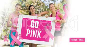 Go Pink text and pink breast cancer awareness women holding card