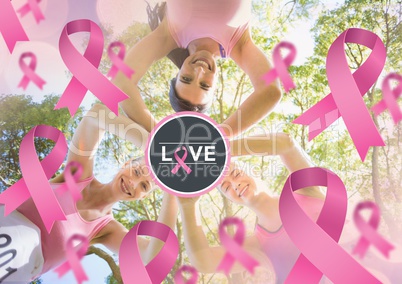 Love text and pink ribbons with breast cancer awareness women putting hands together