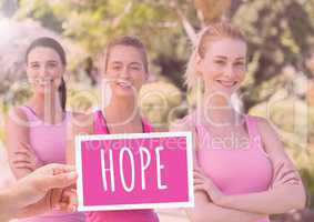 Hope Text and Hand holding card with pink breast cancer awareness women