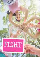 Fight Text and Hand holding card with pink breast cancer awareness women marathon run