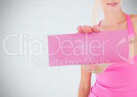 Hand holding card with pink breast cancer awareness woman
