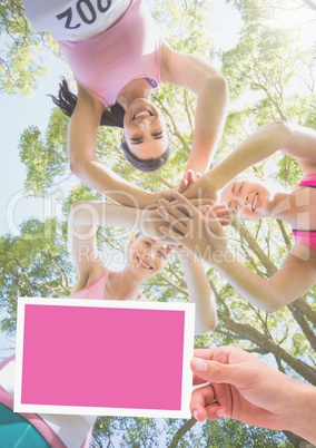 Hand holding card with pink breast cancer awareness women marathon run Hand holding card with pink breast cancer awareness women marathon run