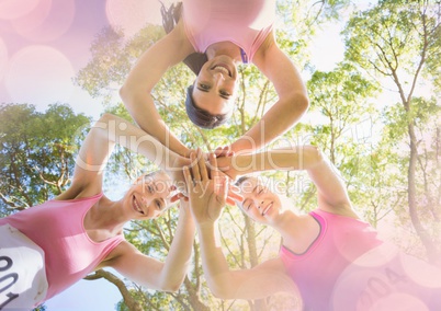 Breast cancer awareness women putting hands together