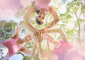 Breast cancer awareness women putting hands together