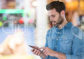 Man holding phone in mall shopping centre