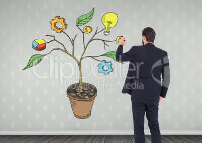 Man holding pen and Drawing of Business graphics on plant branches on wall