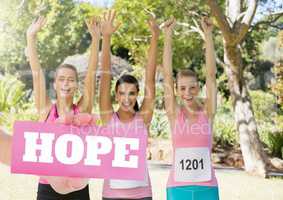 Hope Text and Hand holding card with pink breast cancer awareness women marathon run