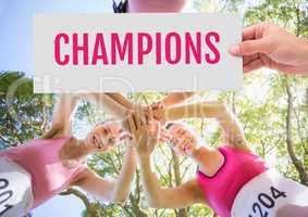 Champions Text and Hand holding card with pink breast cancer awareness women marathon run