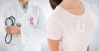Breast cancer doctor and woman with pink awareness ribbon