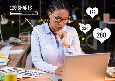 Woman on laptop with Shares and likes status bars