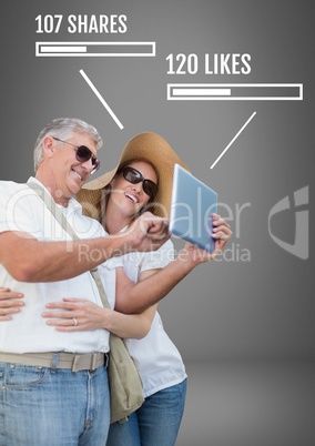 Couple on tablet with shares and likes on Social media interfaces
