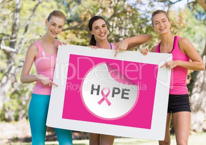 Hope text and pink breast cancer awareness women holding card