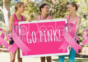 Go pink text and pink breast cancer awareness women holding card