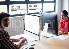 People working on computers in office with Likes status bars
