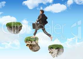 Businessman running up steps of floating rock platforms in sky
