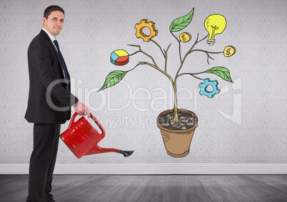 Man holding watering can and Drawing of Business graphics on plant branches on wall