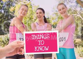 Things to know Text and Hand holding card with pink breast cancer awareness women marathon run