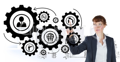 Business woman interacting with people in cogs graphics against office background