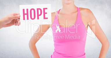 Hope Text and Hand holding card with pink breast cancer awareness woman