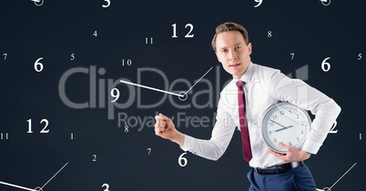 Business man holding a clock against background with clocks
