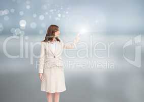 Businesswoman with open hand with bright background