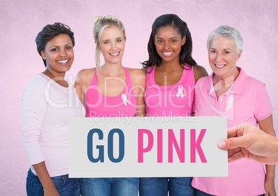 Go Pink Text and Hand holding card with pink breast cancer awareness women