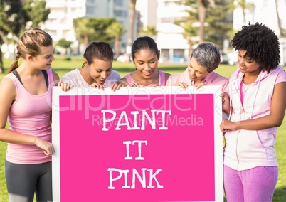 Paint it pink text and pink breast cancer awareness women holding card