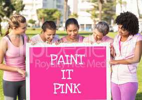 Paint it pink text and pink breast cancer awareness women holding card