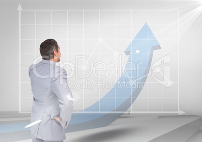 businessman on blue arrow and graph