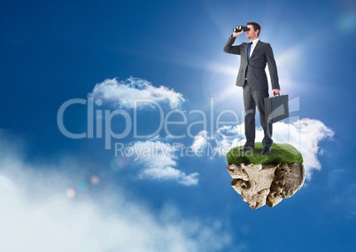 Businessman with binoculars on floating rock platform in sky