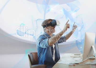 happy man with vr headset at desk