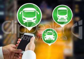 Transport Icons and hand holding phone in city