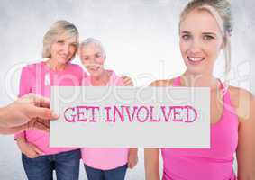 Get Involved Text and Hand holding card with pink breast cancer awareness women