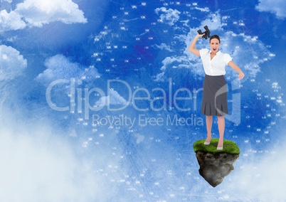 Businesswoman with binoculars on floating rock platform with interface in sky