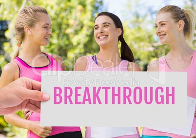 Breakthrough Text and Hand holding card with pink breast cancer awareness women