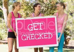 Get checked text and pink breast cancer awareness women holding card
